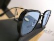 Zonnebril modern design zwart met blauwe glazen